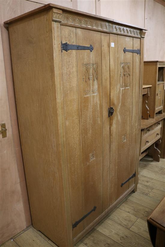 A five piece carved oak bedroom suite